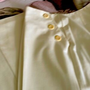 Wide dressy leg pants with button closure on the side.